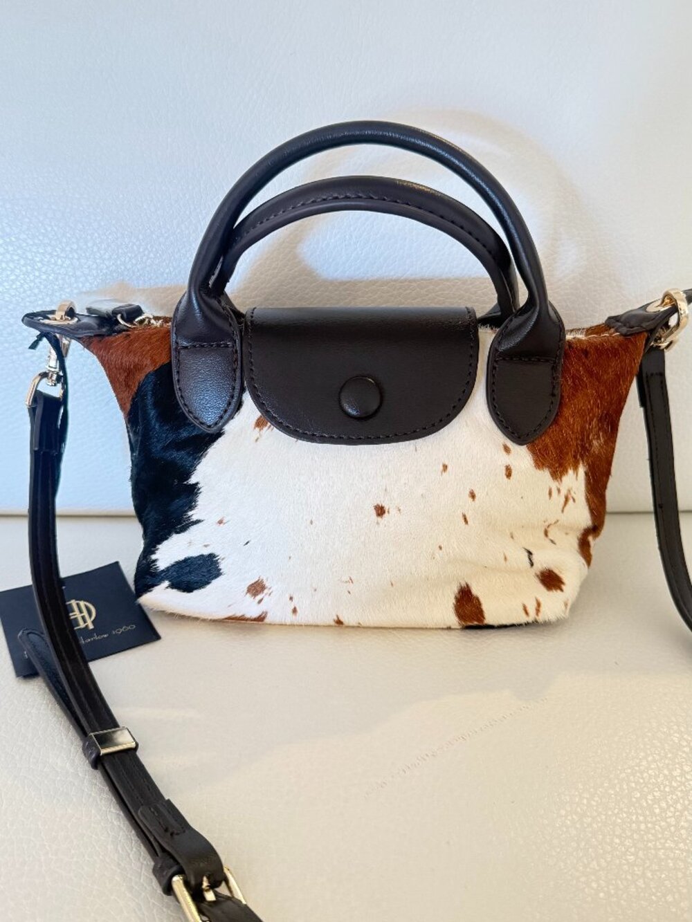 HOUSE OF HARLOW 1960 COW PRINT GENUINE CALF HAIR MINI SATCHEL CROSSBODY BAG